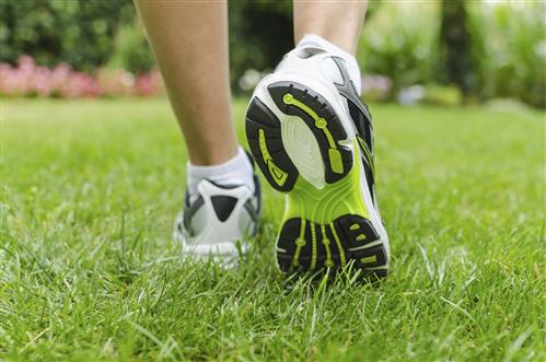 Closeup of Person walking in sneakers
